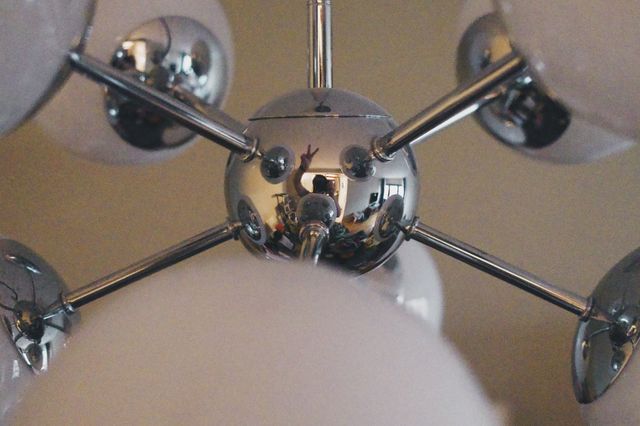 a photograph of a chandelier with a chrome ball and chrome balls
