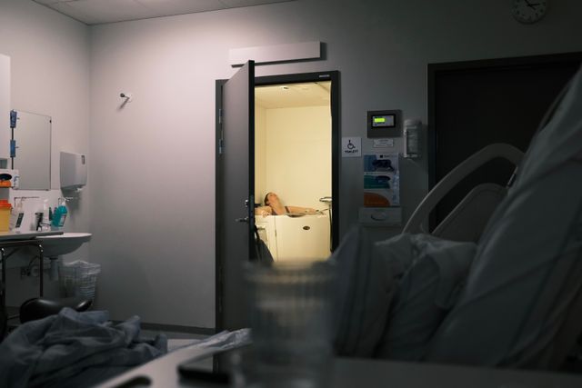a photograph of a hospital room with a hospital bed and a hospital bed
