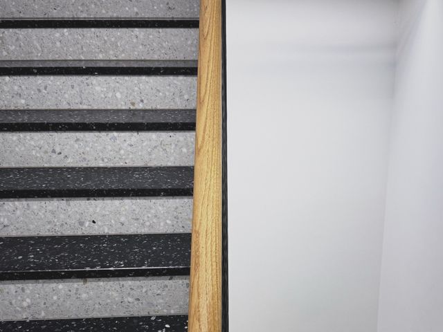 a photograph of a bathroom with a toilet and a toilet paper roll